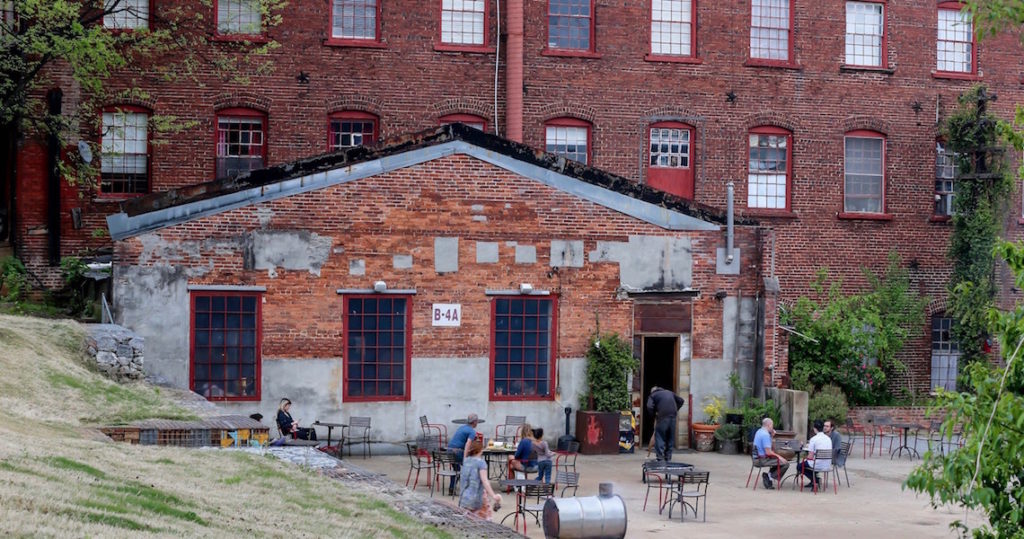 people sitting outside of coffee shop