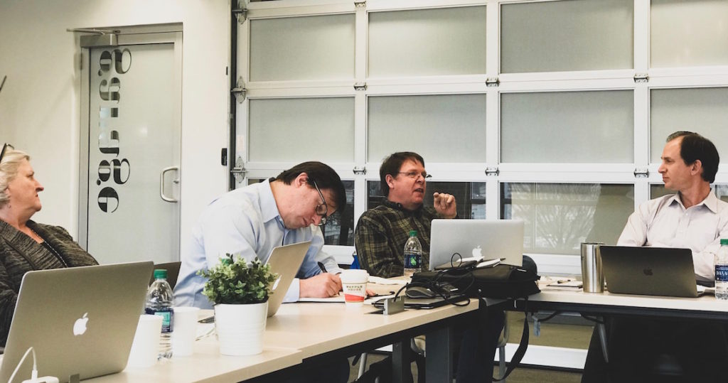 Meeting attendees engaging at speaking event