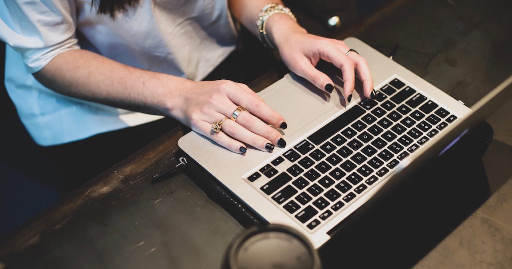 Hands typing on a keyboard