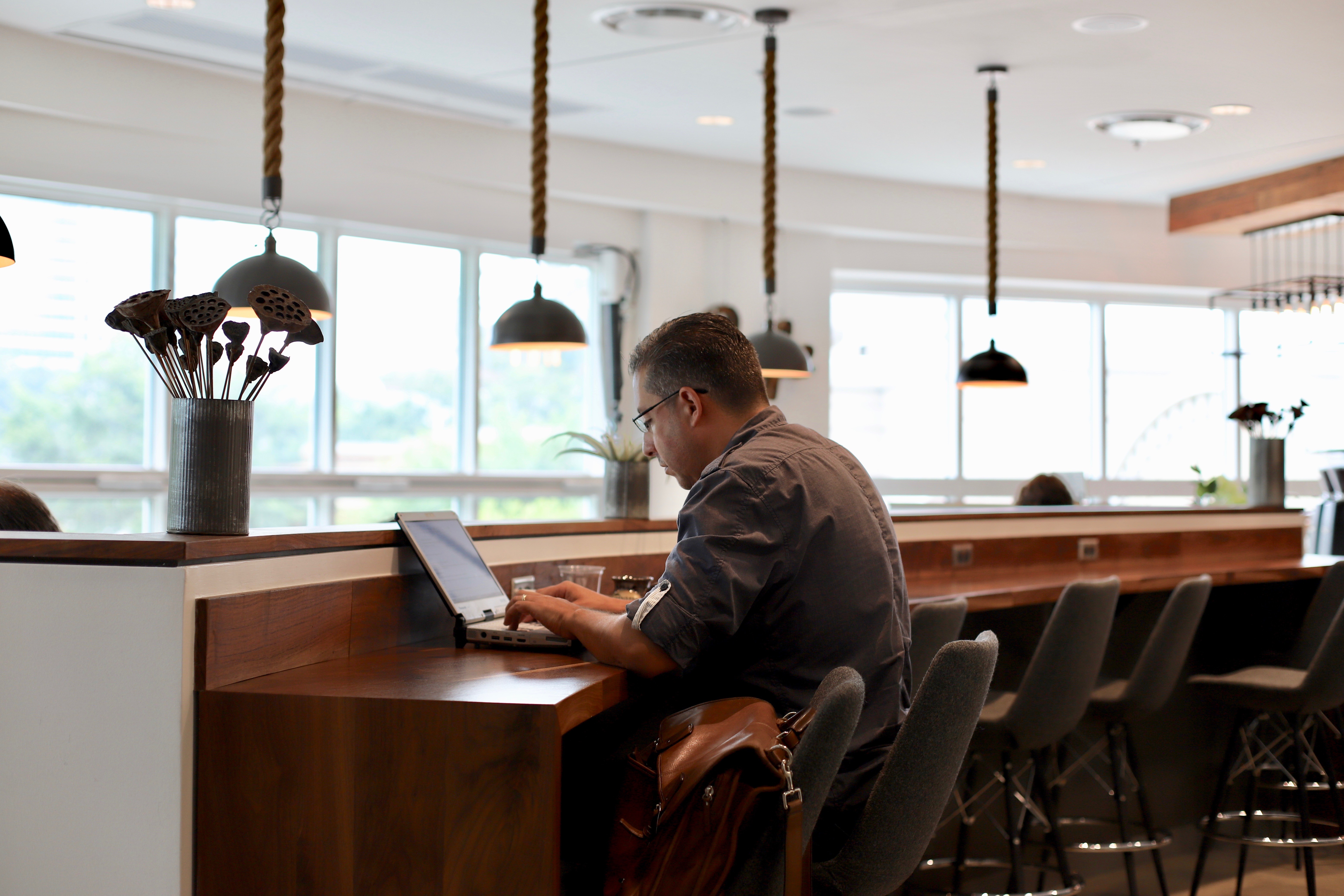 Member working at Coffee Bar at Roam Buckhead