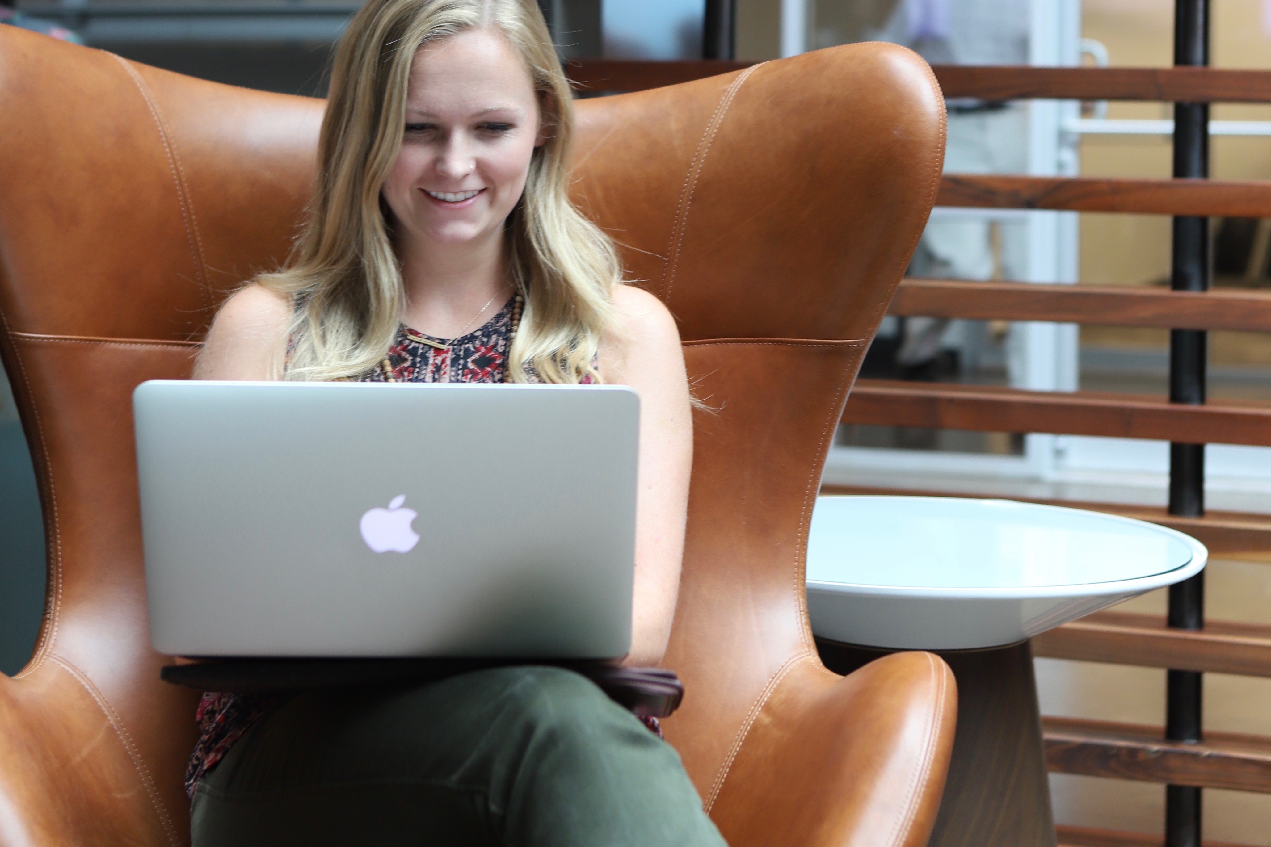 Member working on laptop at coworking space