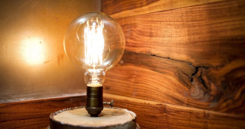 Edison light bulb and wood