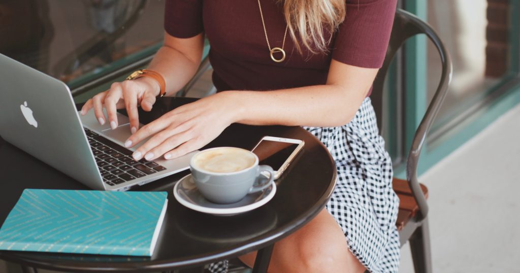 Working on laptop on an outdoor patio