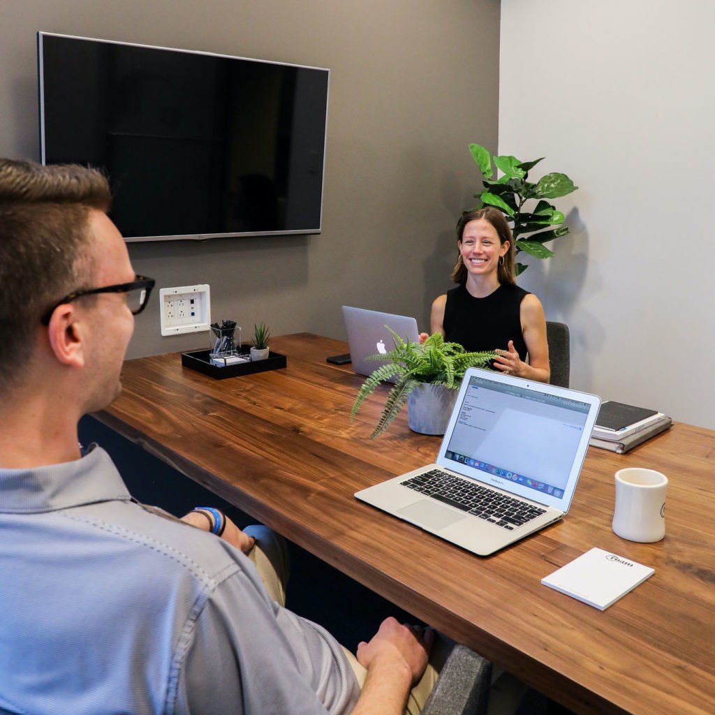 Team meeting in conference room at Roam