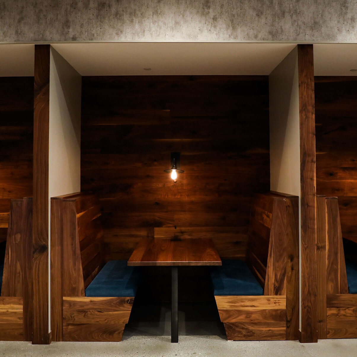 Booth seating in shared workspace at Roam Lenox